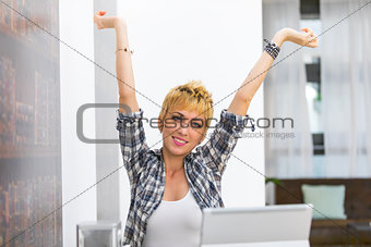 Young woman smiling with outstretched arms