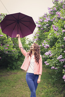 Girl with umbrella in park