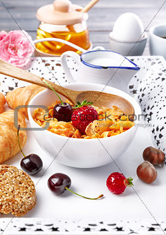 Breakfast with cornflakes berry honey light croissant