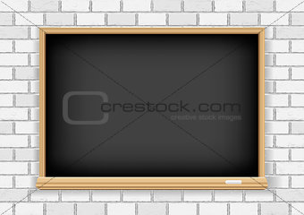 Blackboard on white brick background