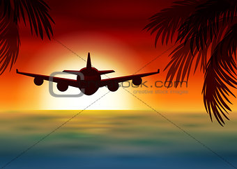 Airplane flies over the sea at sunset
