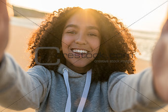 Mixed Race African American Girl Teenager Selfie on Beach at Sun