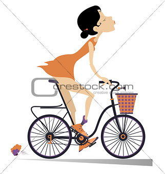 Pretty young woman rides a bike isolated