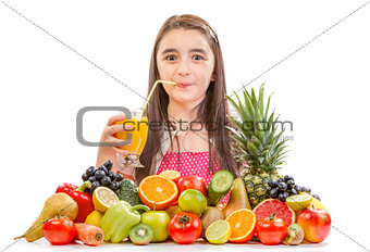 Little girl drinking orange juice