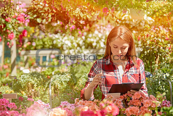 Woman working with garden flowers