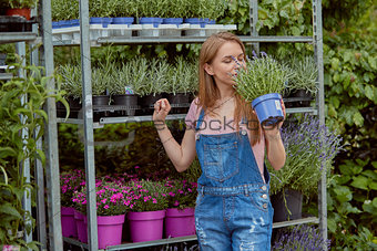 Excited woman with potted flower