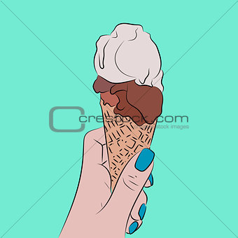 Hand holds a waffle cone with a balls of an ice cream
