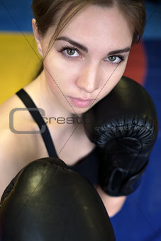 Young adult sexy boxing girl posing with gloves.