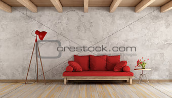 Red sofa in a grunge room