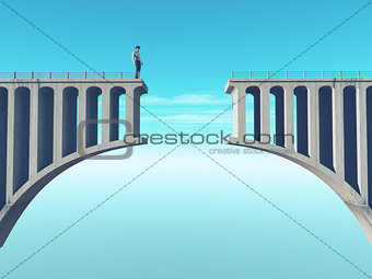 Man in front of a broken bridge