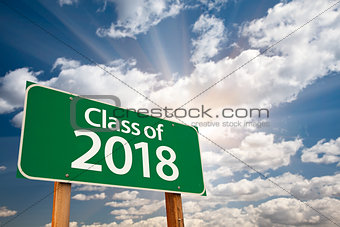 Class of 2018 Green Road Sign with Dramatic Clouds and Sky