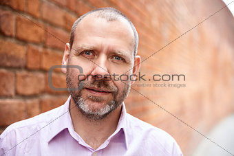 Man against a brick wall 