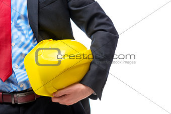 Boss architect in suit with helmet in hand, close-up hand
