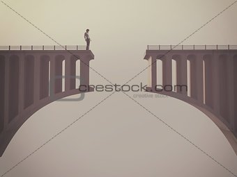 Man in front of a broken bridge