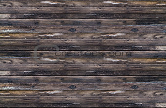 Background stacked stack of dark brown weathered boards