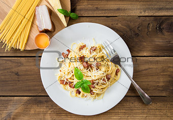 Pasta Carbonara. Spaghetti with bacon and parmesan cheese and ingredients