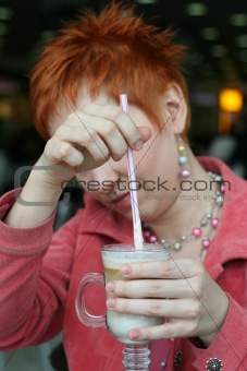 woman dreanking coffe in cafe and smiling happy