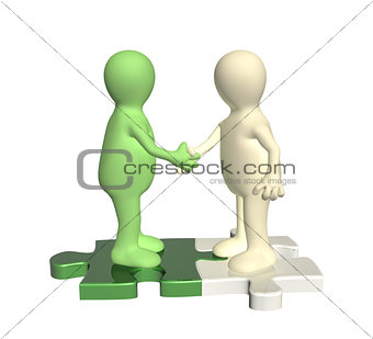 Handshake two 3d mans on attached parts of puzzles