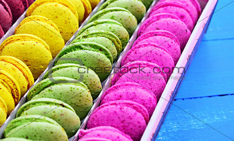 multicolored macaroon in a paper box