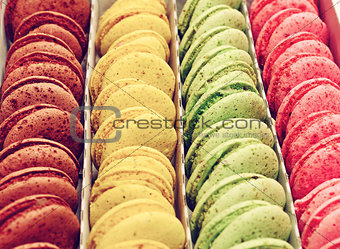 Multicolored macaroons in a paper box