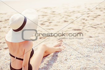 Woman resting on beach