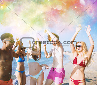 Group of friends dance under a color splash