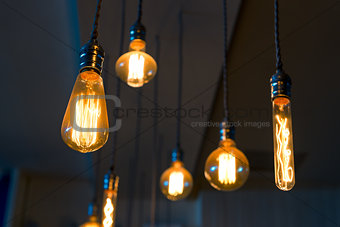 Old retro lamps hang from the ceiling