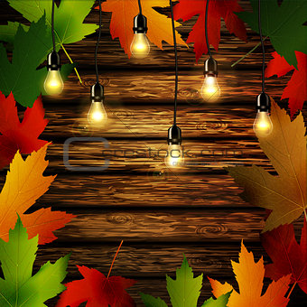 Wooden wall with autumn leaves frame