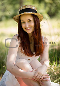 Happy young lady enjoying summer day outdoors.