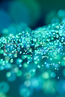 a green and blue colored bokeh background