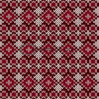 Knitted seamless pattern in red hues