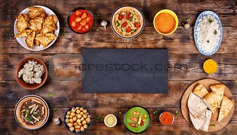 Assorted indian food on a wooden background. Dishes and appetizers of indian cuisine.