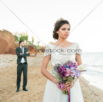 wedding couple, groom and bride in wedding dress near the sea at the seaside