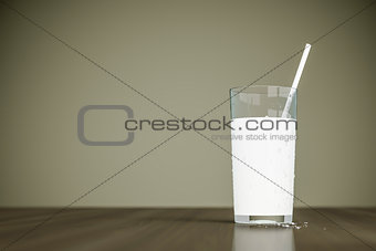 a glass of milk with a straw