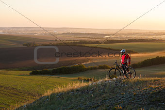 Traveler ride a bike on autumn background