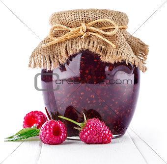 Raspberry confiture in can with fresh berries