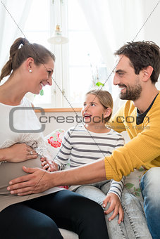 Little family is happy about pregnancy of mother