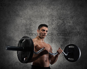 Athletic man training biceps