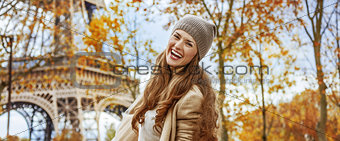 happy young tourist woman near Eiffel tower having fun time
