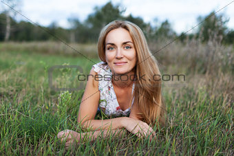 Young girl laying on the grass