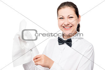 Portrait of bartender waiter with a rag and clean a glass on a w
