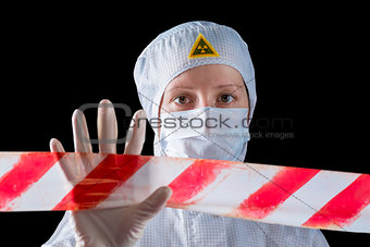 woman in protective clothing working in the infected area, shows