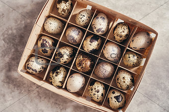 Quail eggs in a wooden box