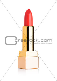 Golden container of luxury cosmetic red lipstick 