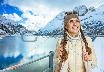 traveller woman in winter outdoors looking into the distance