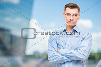 Businessman in glasses young and very successful,  in office