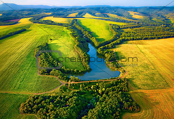 Aerial view of fields with lake in Krasnodar
