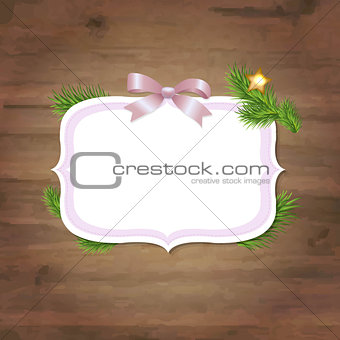 Xmas Label With Pink Ribbon And Wooden Background