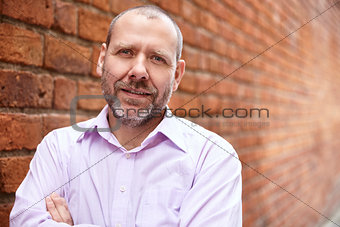 Man against a brick wall 