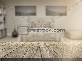 3D wooden table looking out to a defocussed bedroom interior